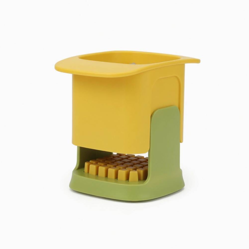 Coupe‑légumes multifonction jaune et vert avec grille de découpe, pratique pour hacher et couper légumes ou fruits en morceaux réguliers, outil compact pour cuisine organisée.