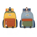 Sac à dos scolaire enfant multicolore, léger et résistant, avec compartiment principal spacieux, poche avant zippée et poches latérales. Modèles jaune et bleu.